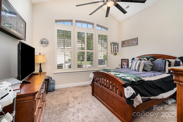 carpeted bedroom with vaulted ceiling and ceiling fan