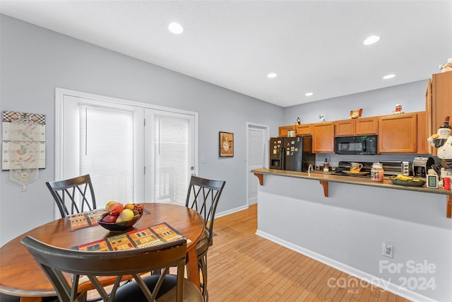 dining room with light hardwood / wood-style flooring