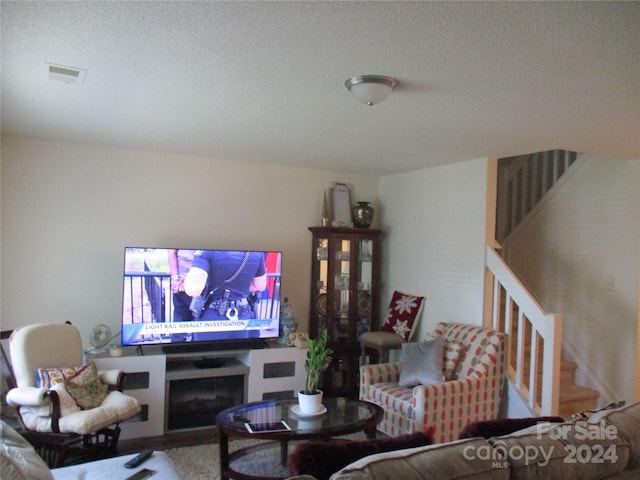 living room featuring a textured ceiling