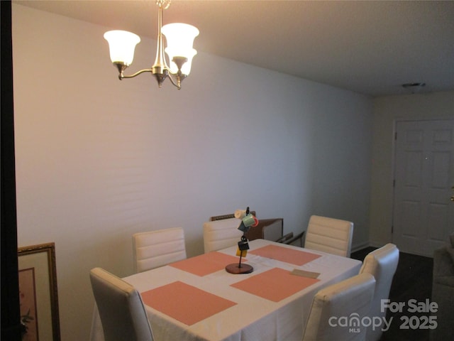 dining room featuring a chandelier