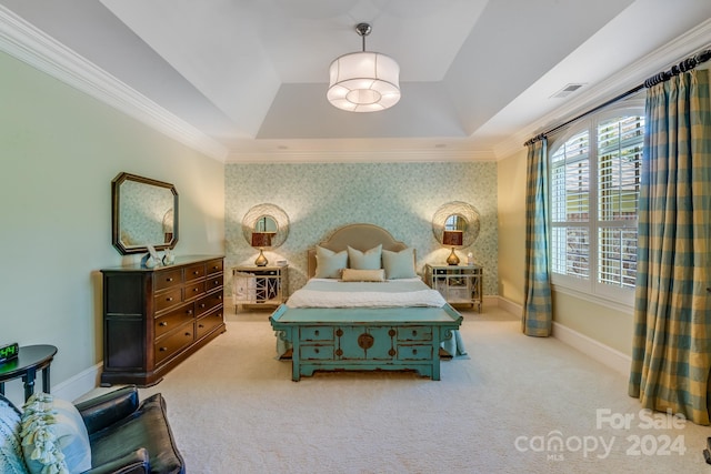 carpeted bedroom featuring crown molding and a raised ceiling