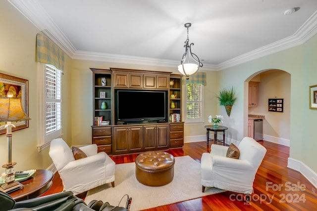 living room featuring dark wood-style floors, baseboards, arched walkways, and crown molding