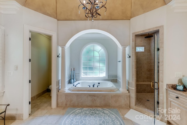 full bathroom featuring separate shower and tub, vanity, toilet, and ornate columns