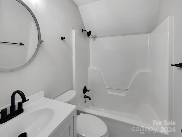 full bathroom with toilet, vaulted ceiling, vanity, and bathing tub / shower combination