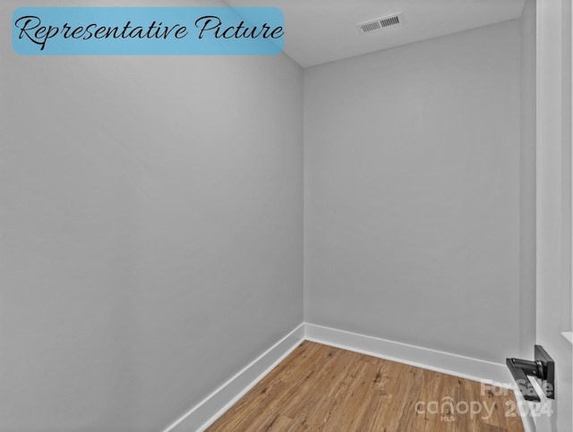 empty room featuring hardwood / wood-style flooring