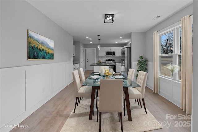 dining room featuring light hardwood / wood-style flooring