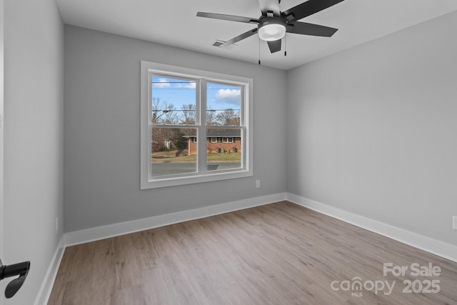 unfurnished room with ceiling fan and light wood-type flooring