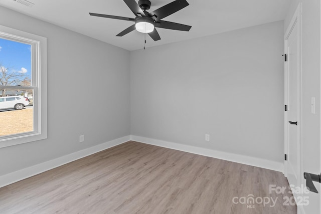 unfurnished room featuring light hardwood / wood-style floors and ceiling fan