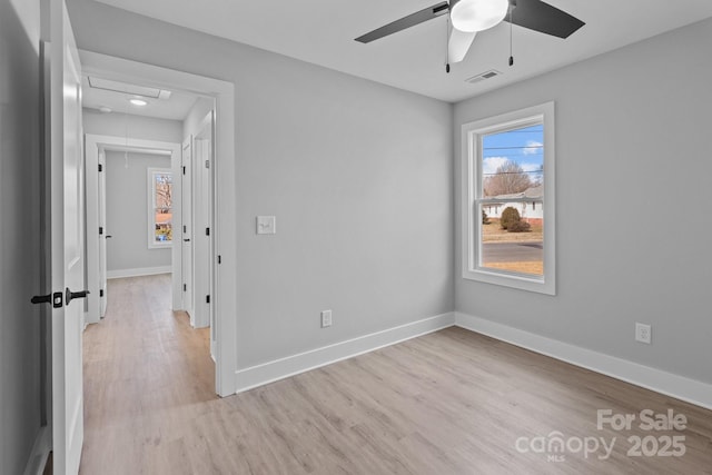 unfurnished room with ceiling fan and light wood-type flooring