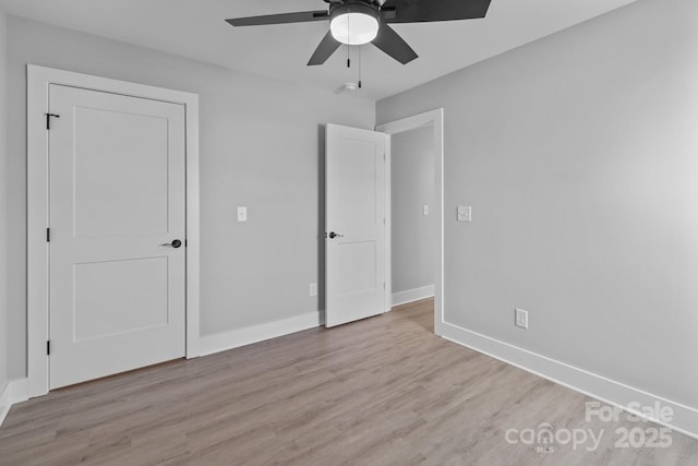 unfurnished bedroom featuring ceiling fan and light wood-type flooring