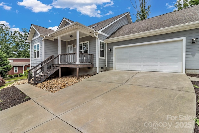 view of front of home with a porch and a garage