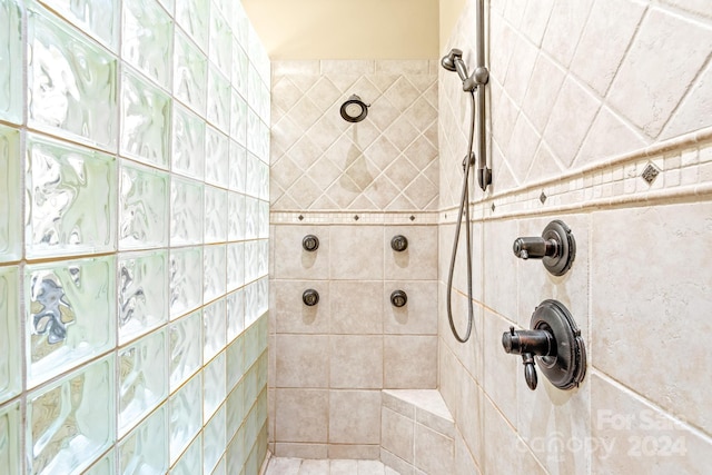 bathroom with tiled shower