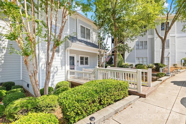 view of front of house with a wooden deck