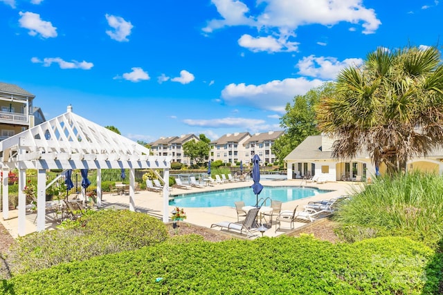 view of pool with a pergola and a patio