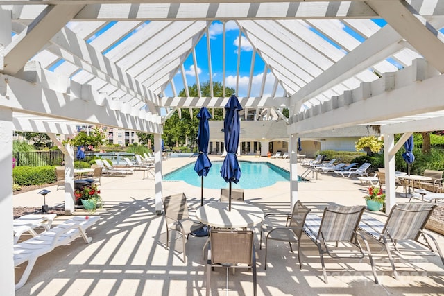 view of pool with a patio area and a pergola