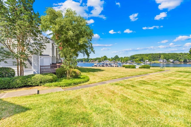 view of yard featuring a deck with water view