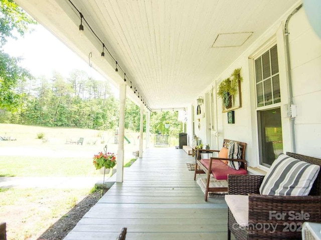 wooden deck featuring covered porch