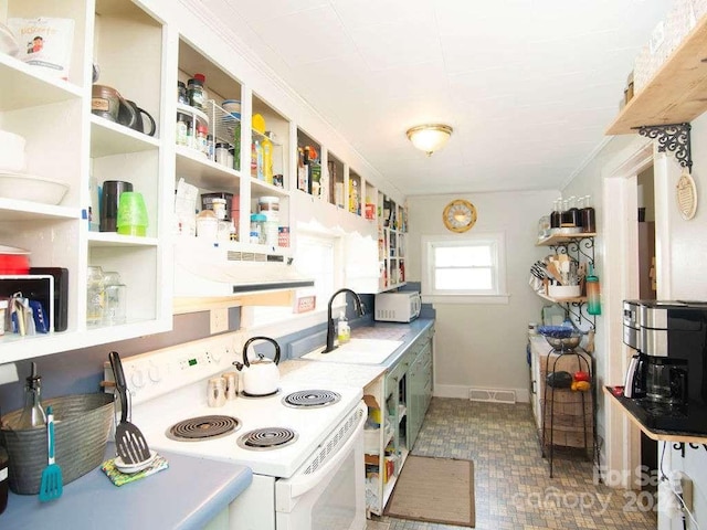 kitchen featuring white appliances, sink, and extractor fan