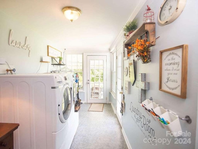 clothes washing area featuring washing machine and clothes dryer