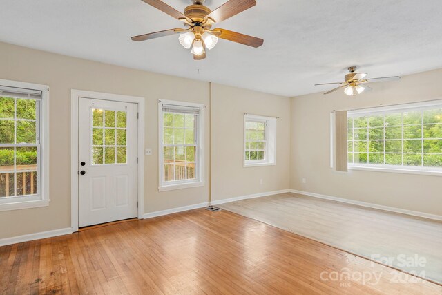 interior space with hardwood / wood-style flooring and ceiling fan