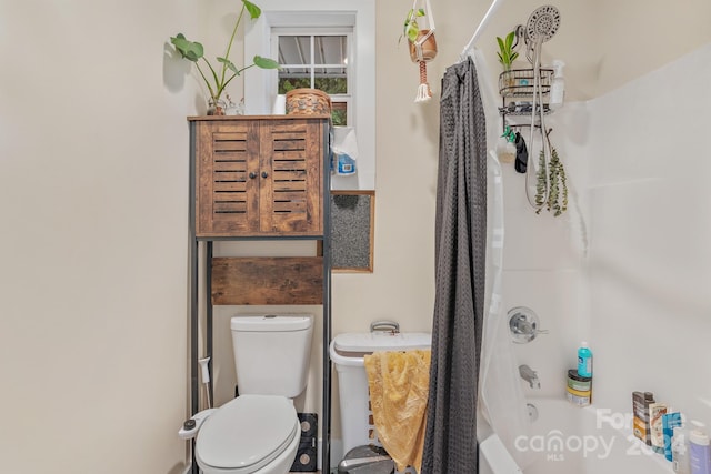 bathroom featuring toilet and  shower combination