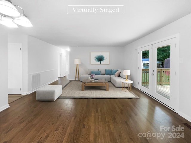 unfurnished living room featuring french doors and dark hardwood / wood-style flooring