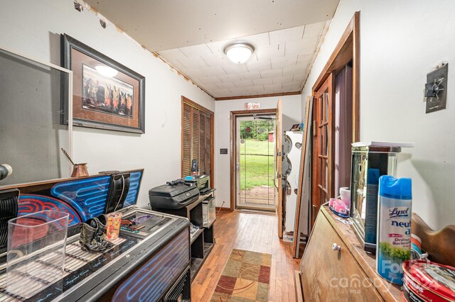 interior space featuring light hardwood / wood-style floors and ornamental molding