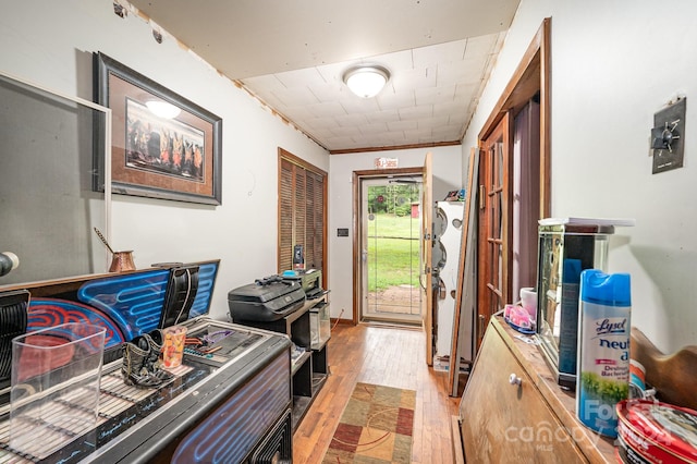 interior space featuring crown molding and hardwood / wood-style flooring