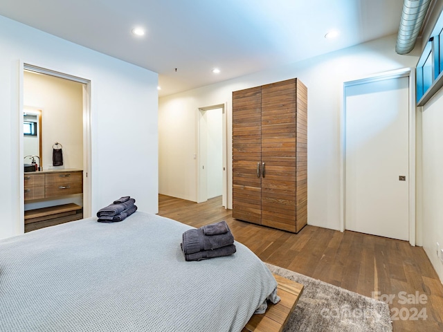 bedroom featuring hardwood / wood-style flooring