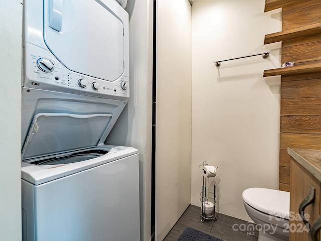 laundry area with stacked washing maching and dryer