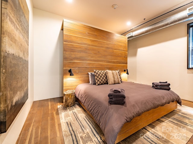 bedroom featuring hardwood / wood-style flooring