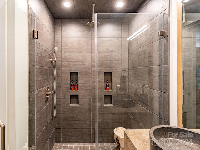 bathroom with a shower with shower door