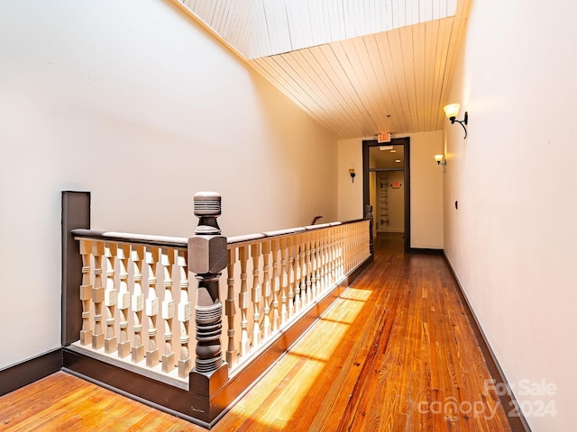 corridor featuring wood ceiling and hardwood / wood-style floors