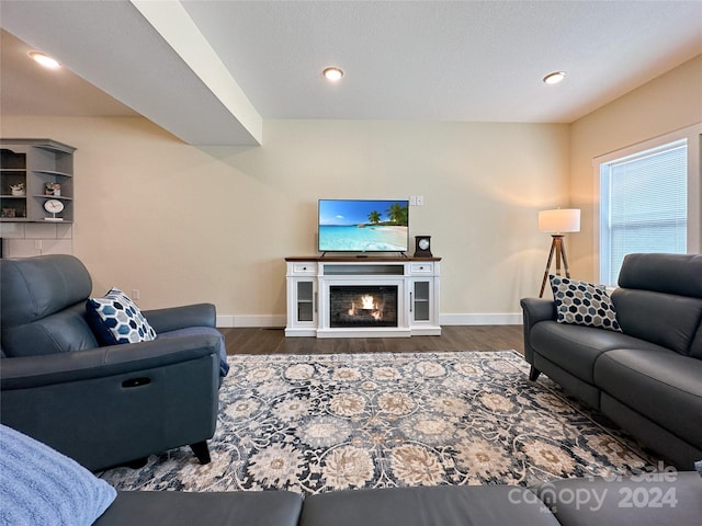 living room with dark hardwood / wood-style flooring