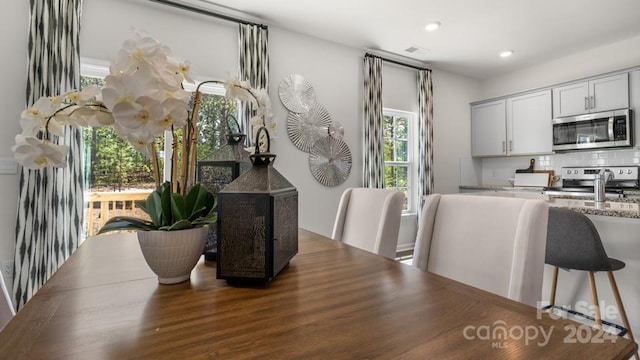 dining space with sink