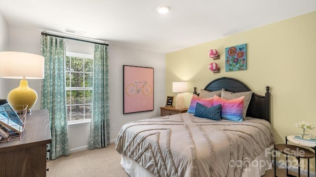 bedroom with light colored carpet