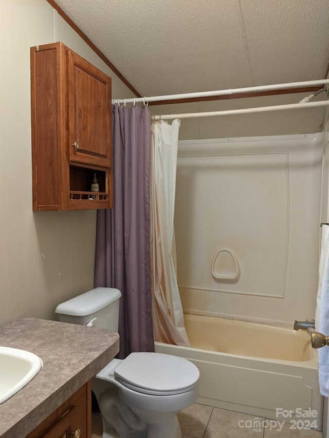 full bathroom with vaulted ceiling, tile patterned floors, toilet, a textured ceiling, and vanity