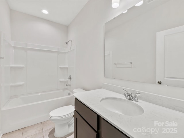 full bathroom with washtub / shower combination, toilet, tile patterned floors, and vanity