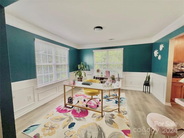 office space featuring crown molding and light wood-type flooring