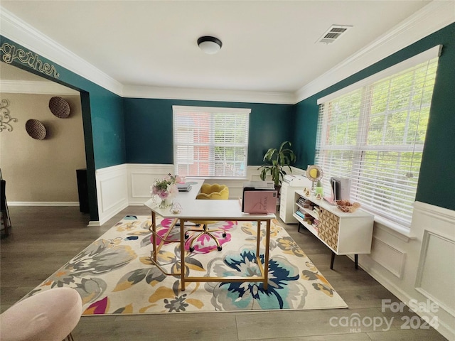 dining room with dark wood-type flooring and ornamental molding