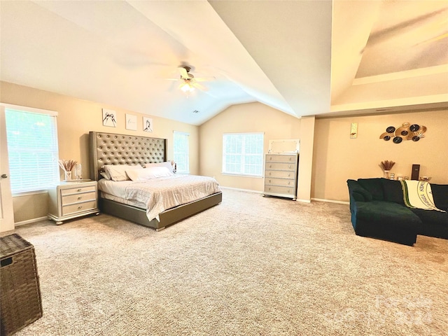 carpeted bedroom featuring multiple windows and ceiling fan