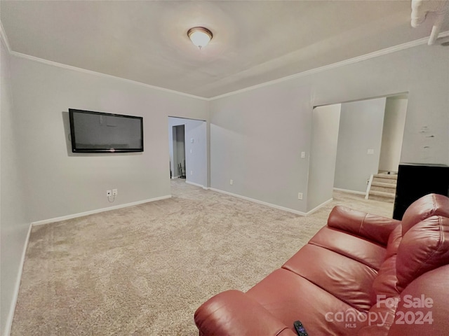 carpeted living room with ornamental molding