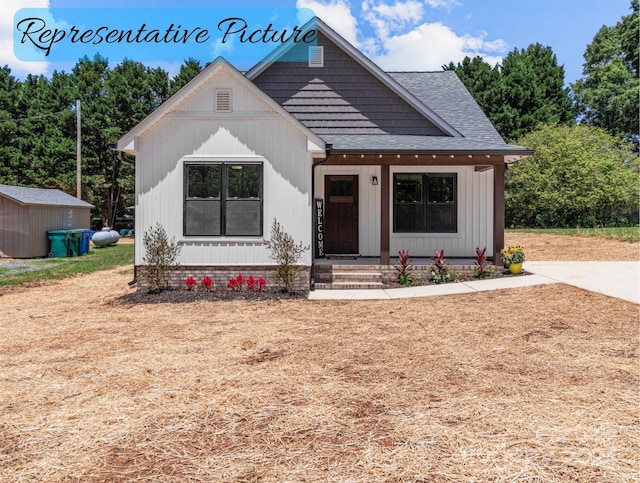 view of front of house featuring a storage shed