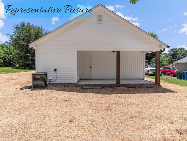 rear view of house with cooling unit