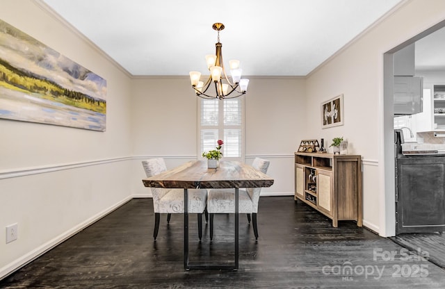 dining space featuring crown molding, a notable chandelier, baseboards, and dark wood-style floors