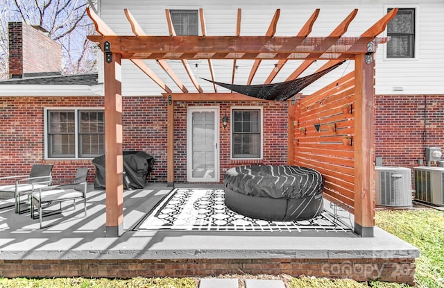 view of patio / terrace featuring area for grilling, cooling unit, and a pergola