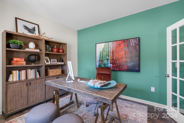 home office with hardwood / wood-style floors