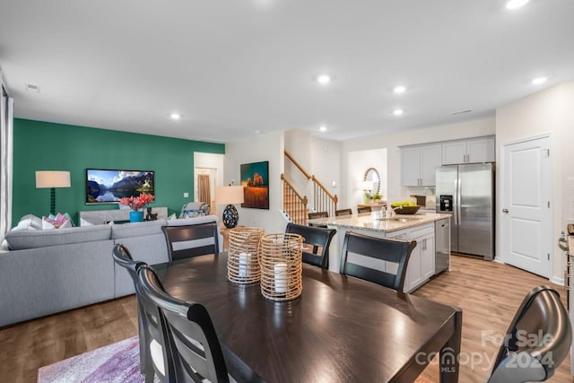 dining room with light hardwood / wood-style flooring