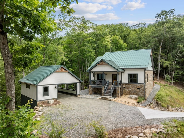 view of front of home featuring a carport and a porch