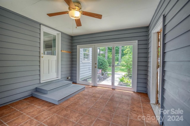 view of patio featuring ceiling fan